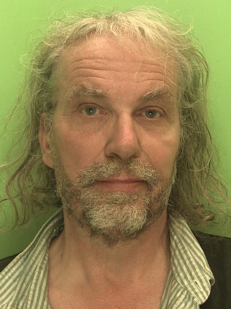 Robert Hokr, a man in his fifties with long hair and a beard