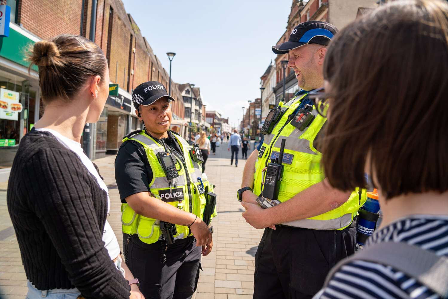 Officers talking to two ladies on high street 