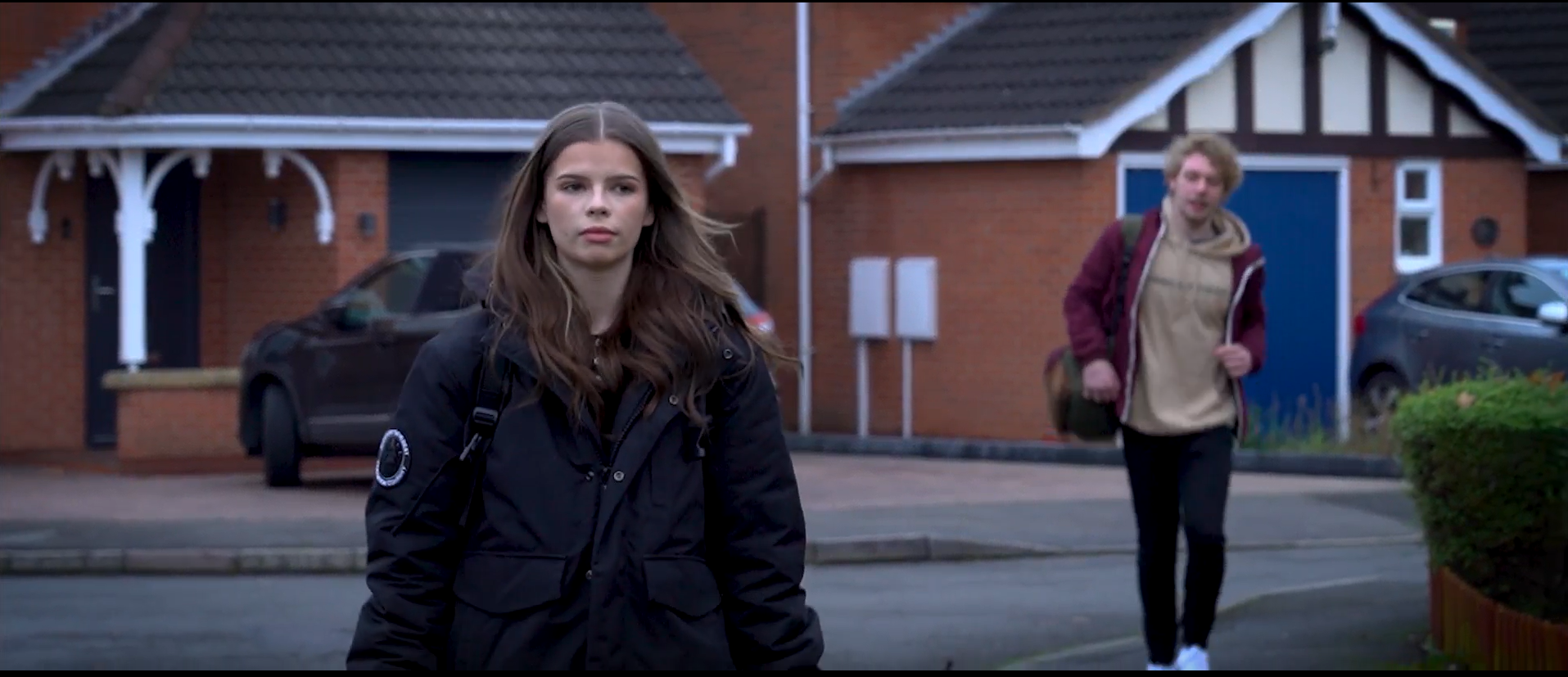 Snapshot from Following video where Beth (brown haired girl) is being followed home by Jack (blonde haired boy)
