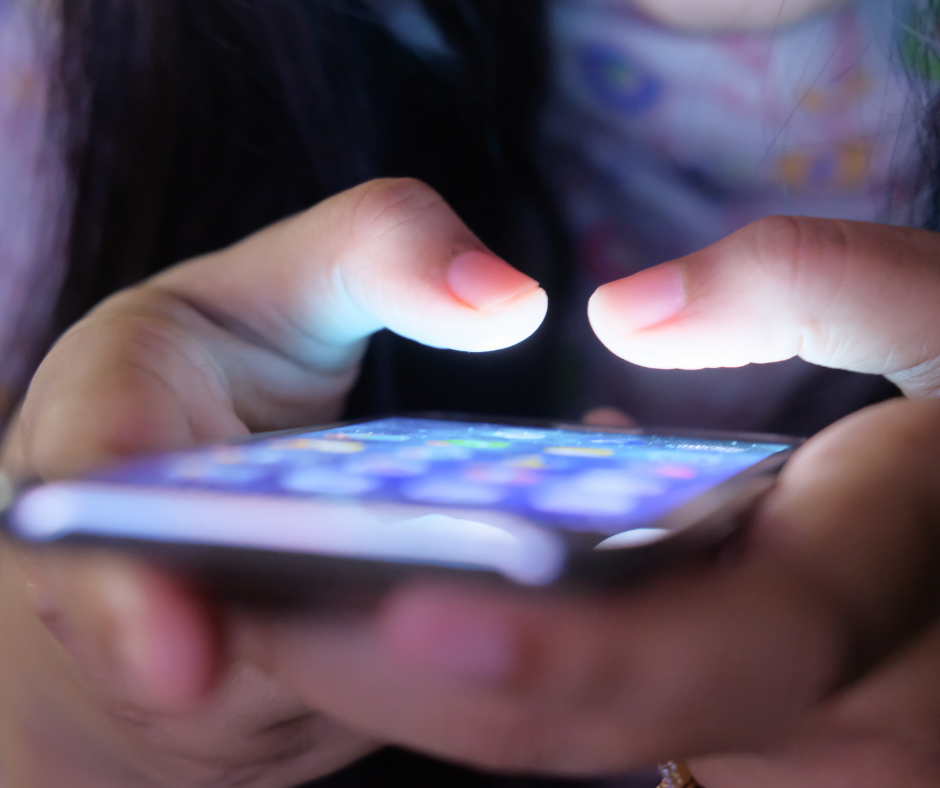 close up of typing on a touchscreen phone