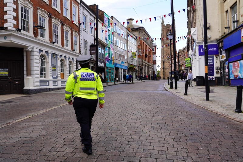 Officer patrolling high street in Derby.
