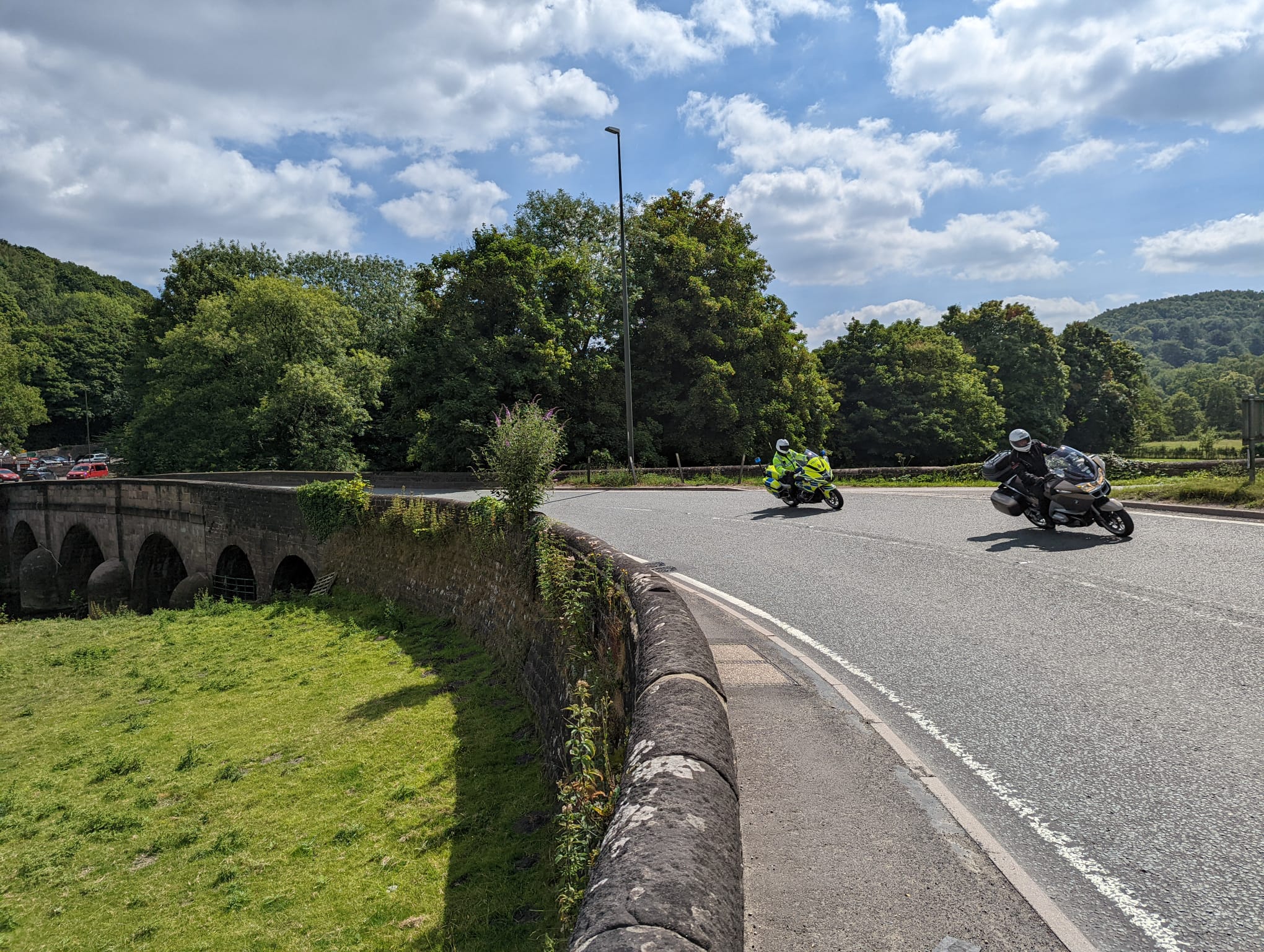 A motorbike being followed by a police motorbike in the Peak District. This photo was taken on our BikeSafe course.