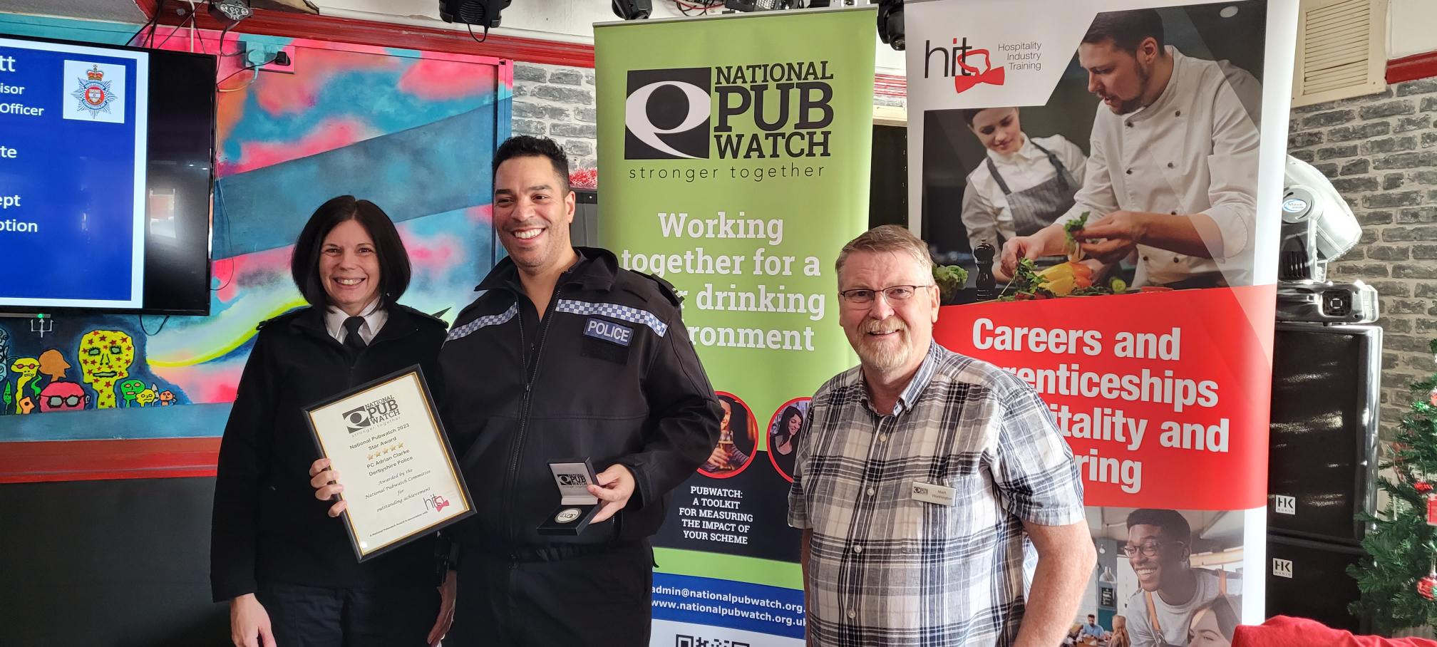 PC Ady Clarke (centre) with Chief Inspector Katie Andrews and Mark Worthington from PubWatch