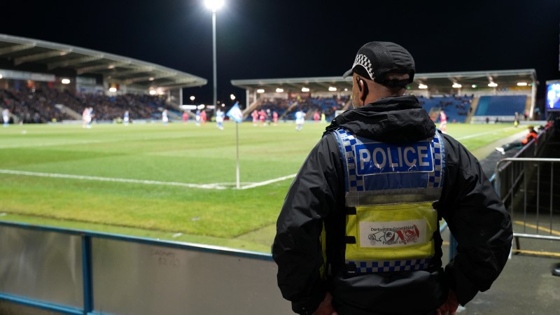 Officer overlooking football pitch