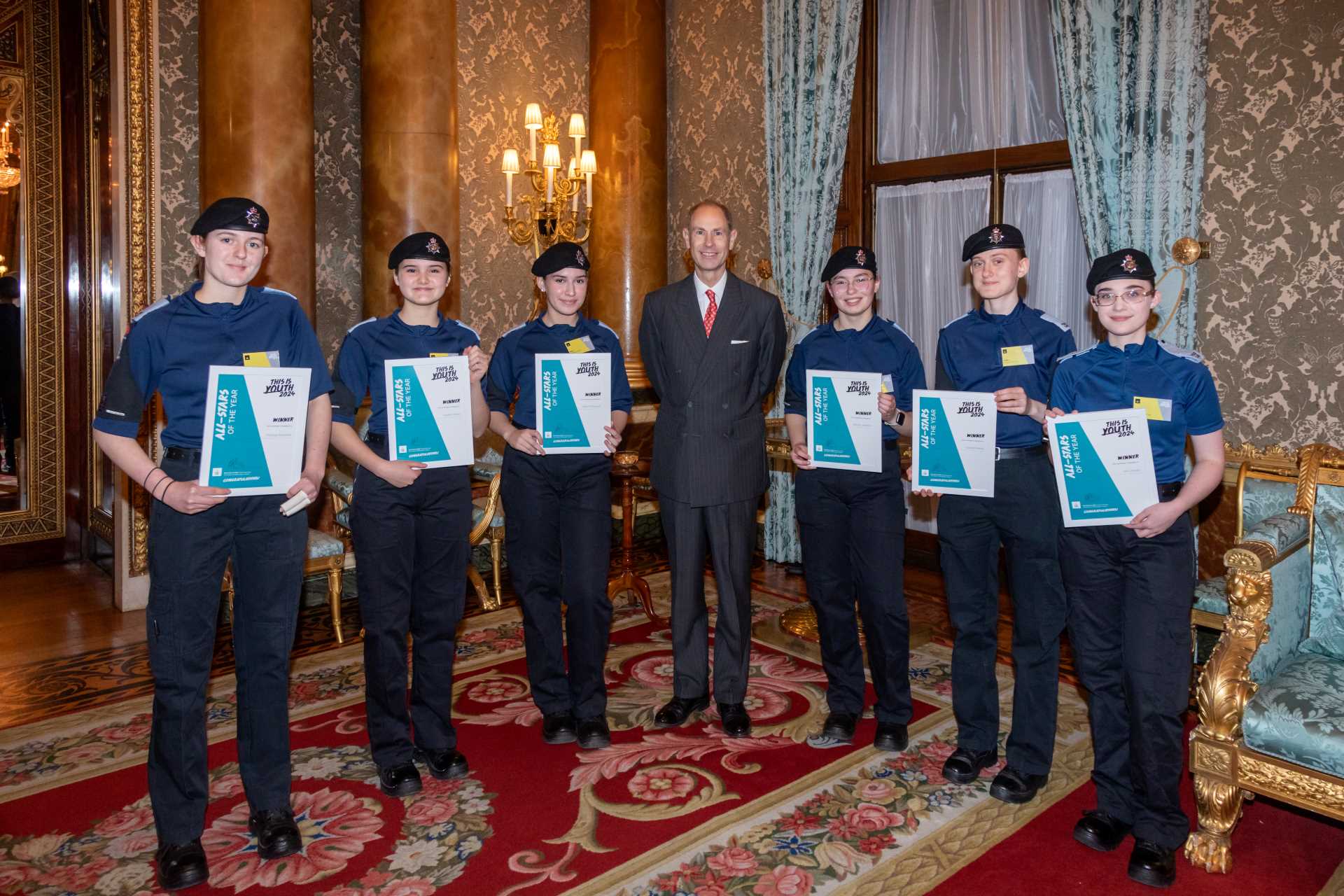 The cadets who won the award, stood with their certificates and The Duke of Edinburgh, Prince Edward. 