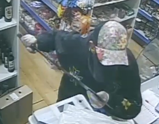 Officers investigating a robbery in which a shop worker was threatened with a machete have released CCTV images of a man we would like to speak to.