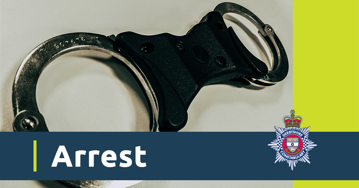 Picture of handcuffs with word arrested over the top