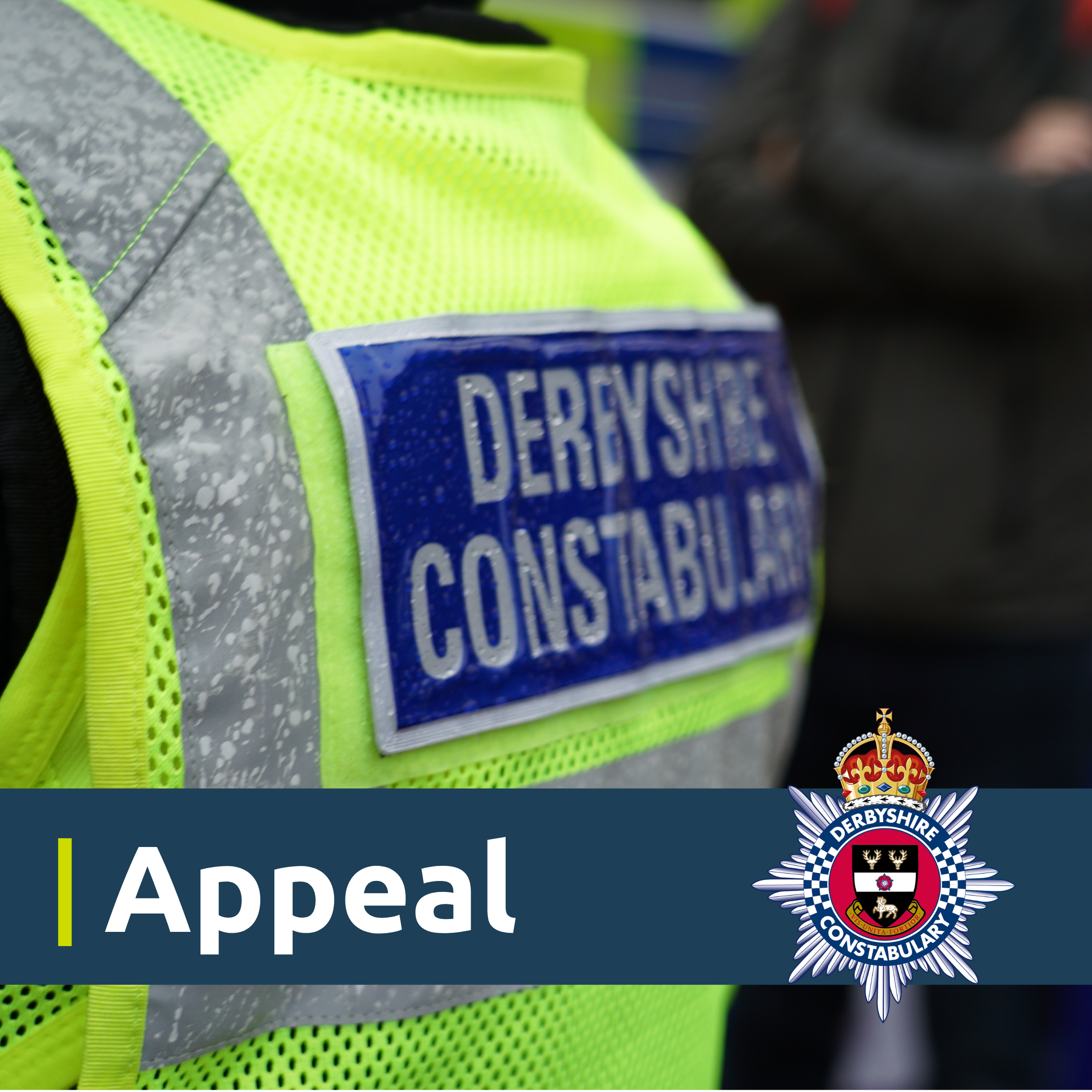 Back of a police officer high vis with appeal at the bottom on a blue banner next to a Derbyshire Constabulary crest 