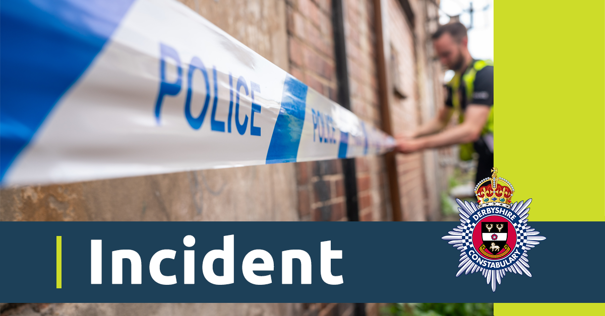 A close up of some police tape with an officer in the background. There is also a blue banner with the word incident and the Derbyshire Constabulary crest