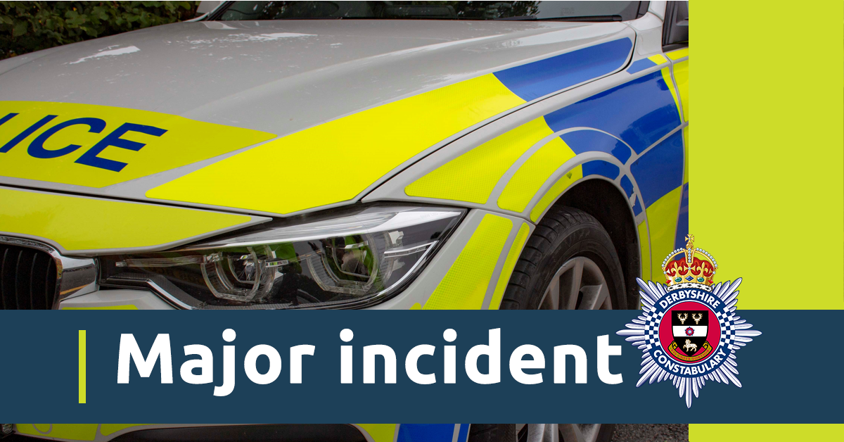 A close up image of a police car. There is also a blue banner with the words major incident and the Derbyshire Constabulary crest