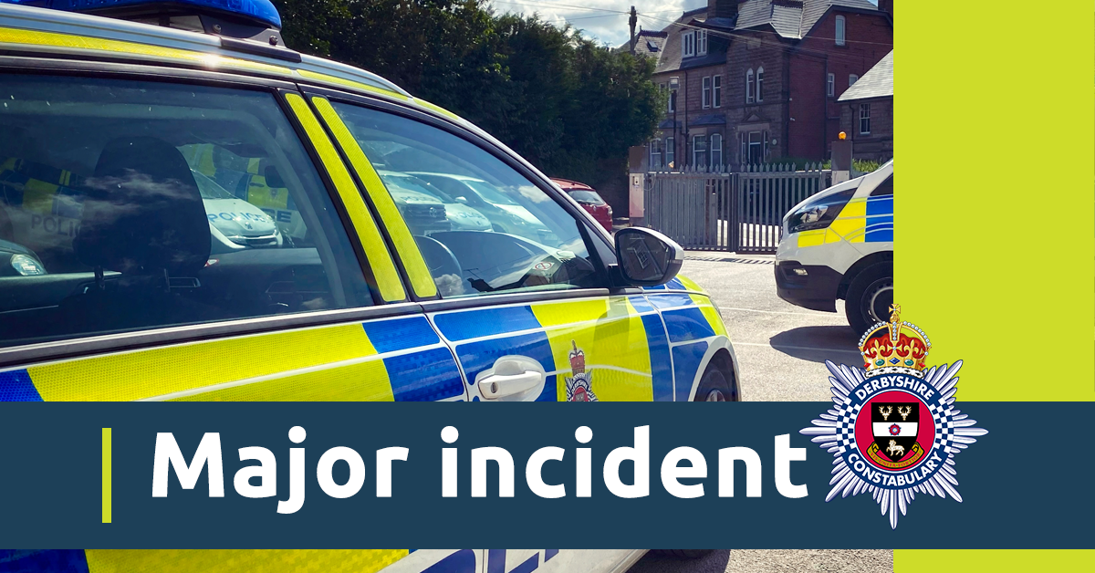 A close up image of a police car. There is also a blue banner with the words major incident and the Derbyshire Constabulary crest 