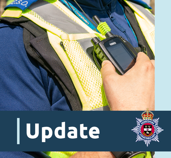 A close up of an officer holding a radio. There is also a blue banner with the word update and the Derbyshire Constabulary crest
