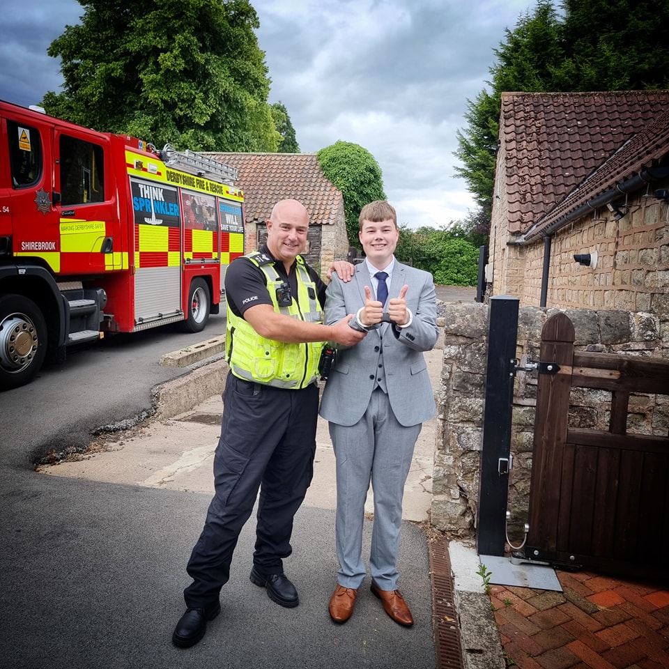 Sergeant Mark Church with teenager William Barlow, who we helped make a very special entrance to his prom last year