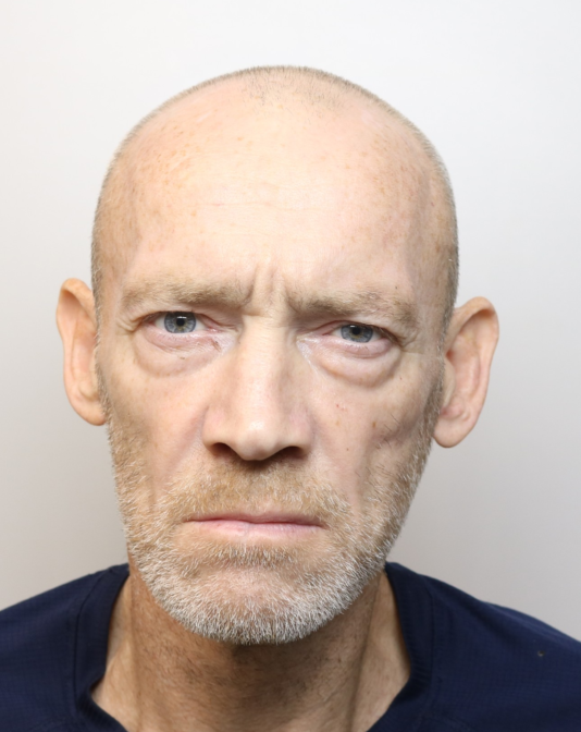 A man has been jailed after robbing an elderly woman who was sat in her car outside a hospital in Derby.