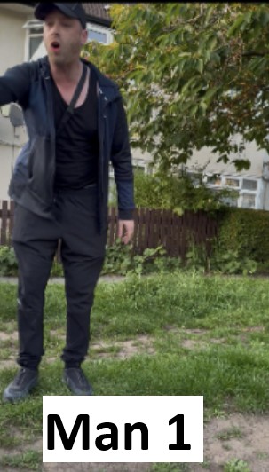 Man wearing all black clothing and wearing a baseball hat